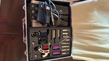 2 tattoo guns with ink and needles