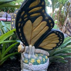 Beautiful butterfly statue on pedestal outdoor garden decor
