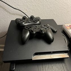 $65 PS3 W/ 2 Controllers And 6 Games 