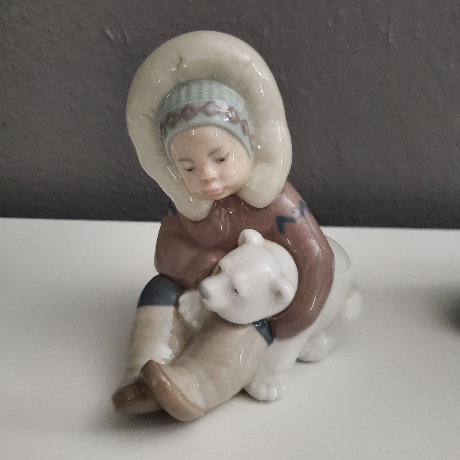 Precious Lladro collectible, 'Eskimo' playing with baby Polar Bear.