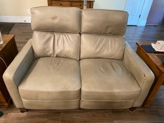 LEATHER LOVESEAT. WITH ELECTRIC  CONTROLS