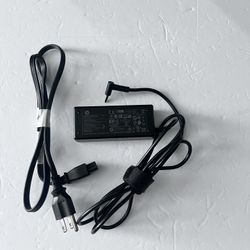 an AC power adapter (charger) for an HP laptop 