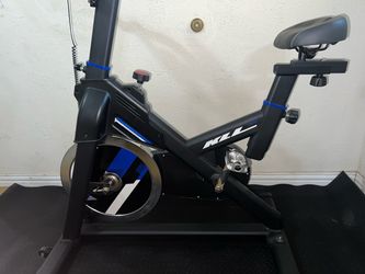 Brand new KLL indoor stationary cycling bike with new mat