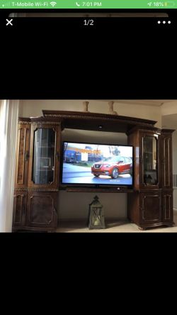 Entertainment center. 7 ft. Tall and 9ft 4 in. Wide but can expand more wider.