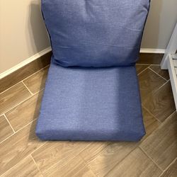 Set of four blue patio chair cushions