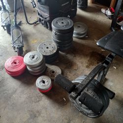 Assortment of Weights All Sizes  Weight bench 