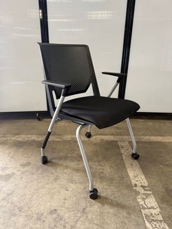 Haworth Very black fabric black perforated back on casters