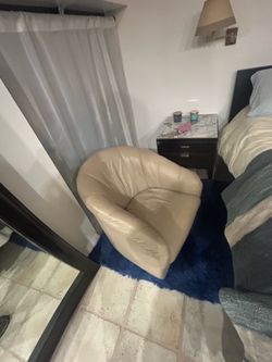 Swivel white leather chair