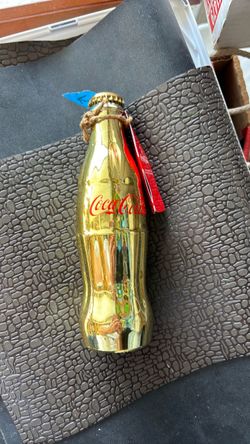 Limited edition, gold Coca-Cola bottle empty