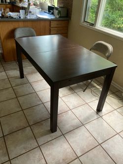 Extensible dining table.  Minor cosmetic scuffs