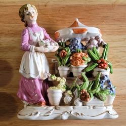 Vintage woman with her plant flower stand ceramic figure 7 1/4" tall