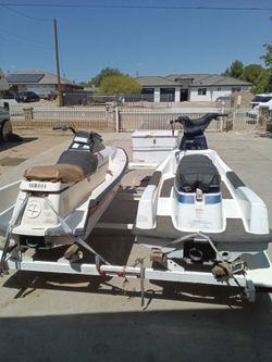 Seadoos one is a Yamaha wave runner one is a Kawasaki and trailer
