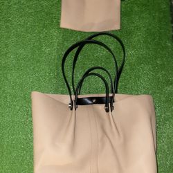 AllSaints Allington leather tote bag in a light pink/beige color with black handles. 