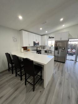 Kichen Cabinets/ Countertops/ Laminate Flooring And Closets. 
