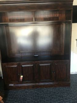 New artistica wood Entertainment center 285