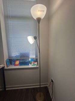 2 bronze colored light stands