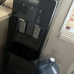 Water dispenser/ Ice maker  with 2 water gallons included