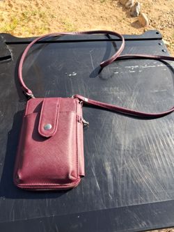 Mundi Jacqui cell phone wallet in a wine red color.