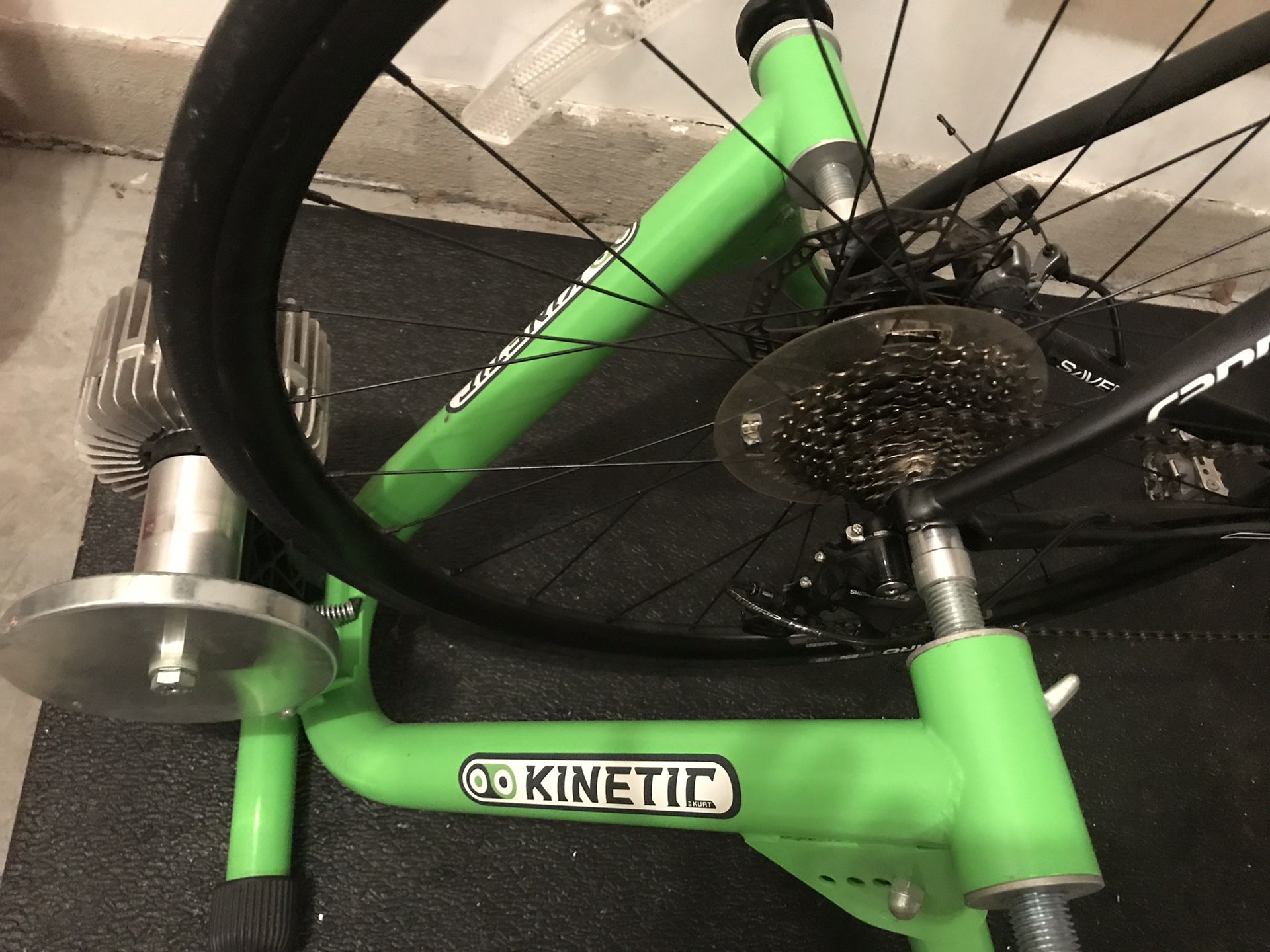 Kurt Kinetic bike trainer (not the bike), riser ring, and mat