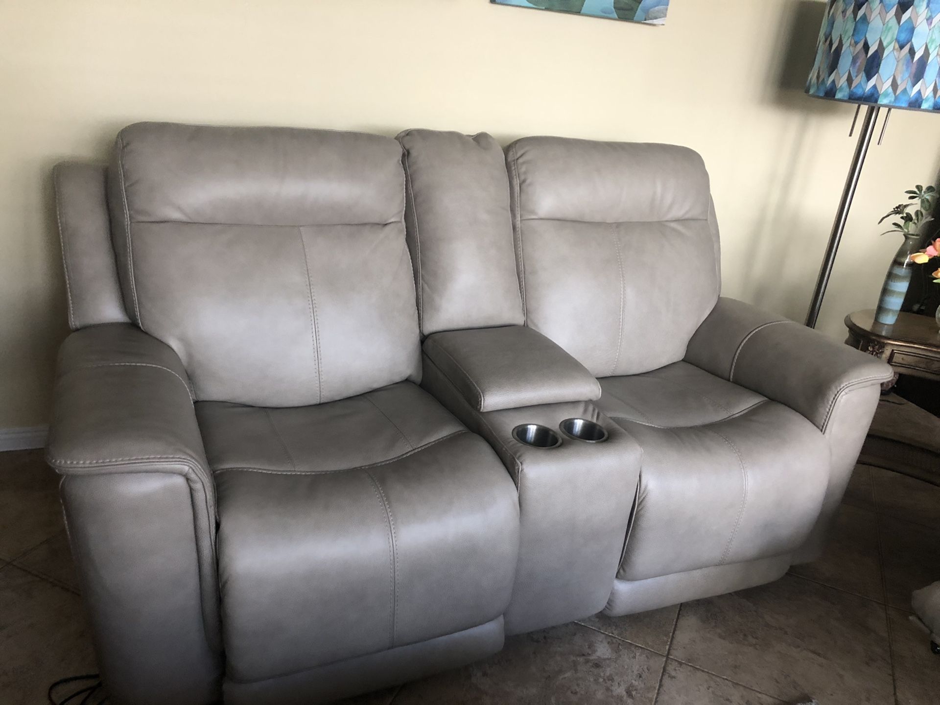 Leather sofa auto recliner plugs into wall, both sides work and both sides have USB charging