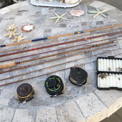 THREE (3) Fly Fishing Rods with Reels Plus a box with some Flies.