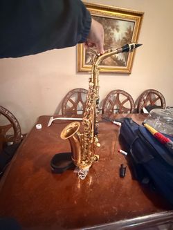 Alto saxophone with accessories