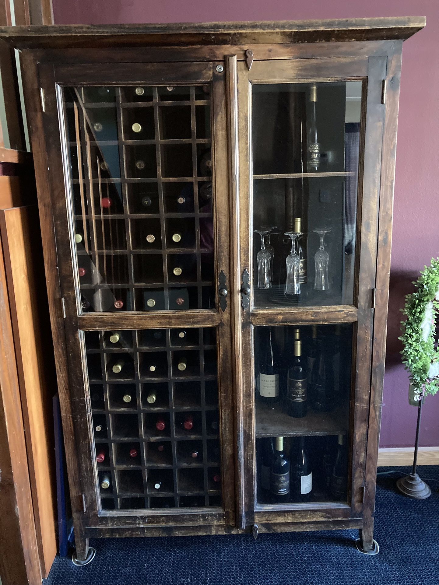Wine Bar/Cabinet/Rack Does Not Include Contents Lots of wine bottle storage, one side locks - heavy wood