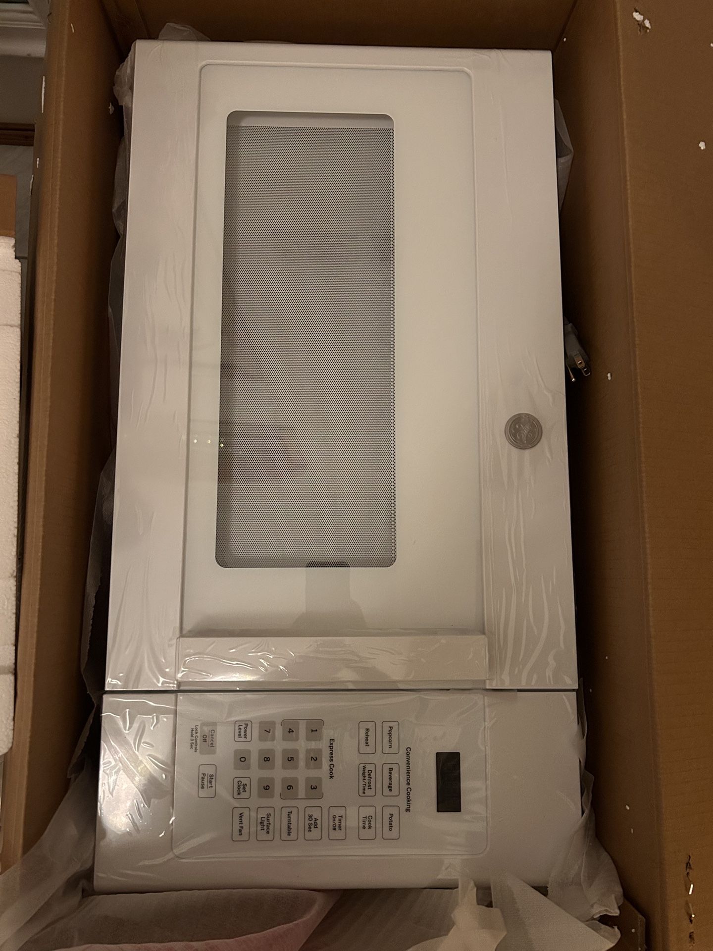 GE Over- The Range-Microwave In White.