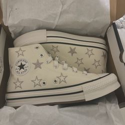 Cream and white Converse All Stars high top