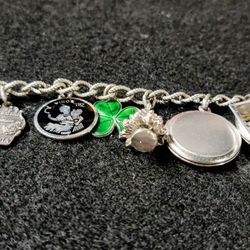 VINTAGE STERLING 12 CHARM WELLS CHARM 7" BRACELET WEIGHS 40.69 GRAMS  