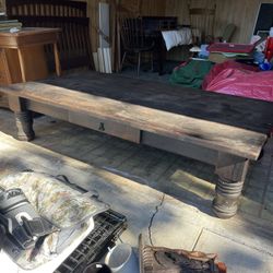 Large, dark wood coffee table