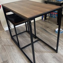 table and two chairs plus seat covers 