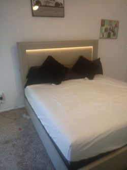 Grey king size  bed with headboard and frame
