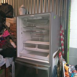 2 year Old Whirlpool Refrigerator.  Good Condition, Doors Off for moving but easily assembled.