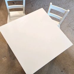 Kid's Pottery Barn table with 2 chairs.