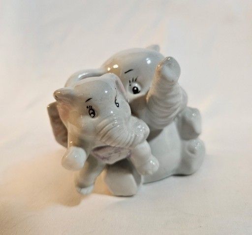 Vintage Porcelain GOT Figurine Of A Mother Elephant And Her Baby Made In Japan 3' Tall Excellent Vintage Condition No Chips Or Cracks The product is a