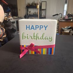 HAPPY Birthday Ceramic Vase/Planter Featuring White Ceramic With HAPPY Birthday Text & A Colorful Striped Base W/Red Bow 6"Hx6"x3" Excellent Condition