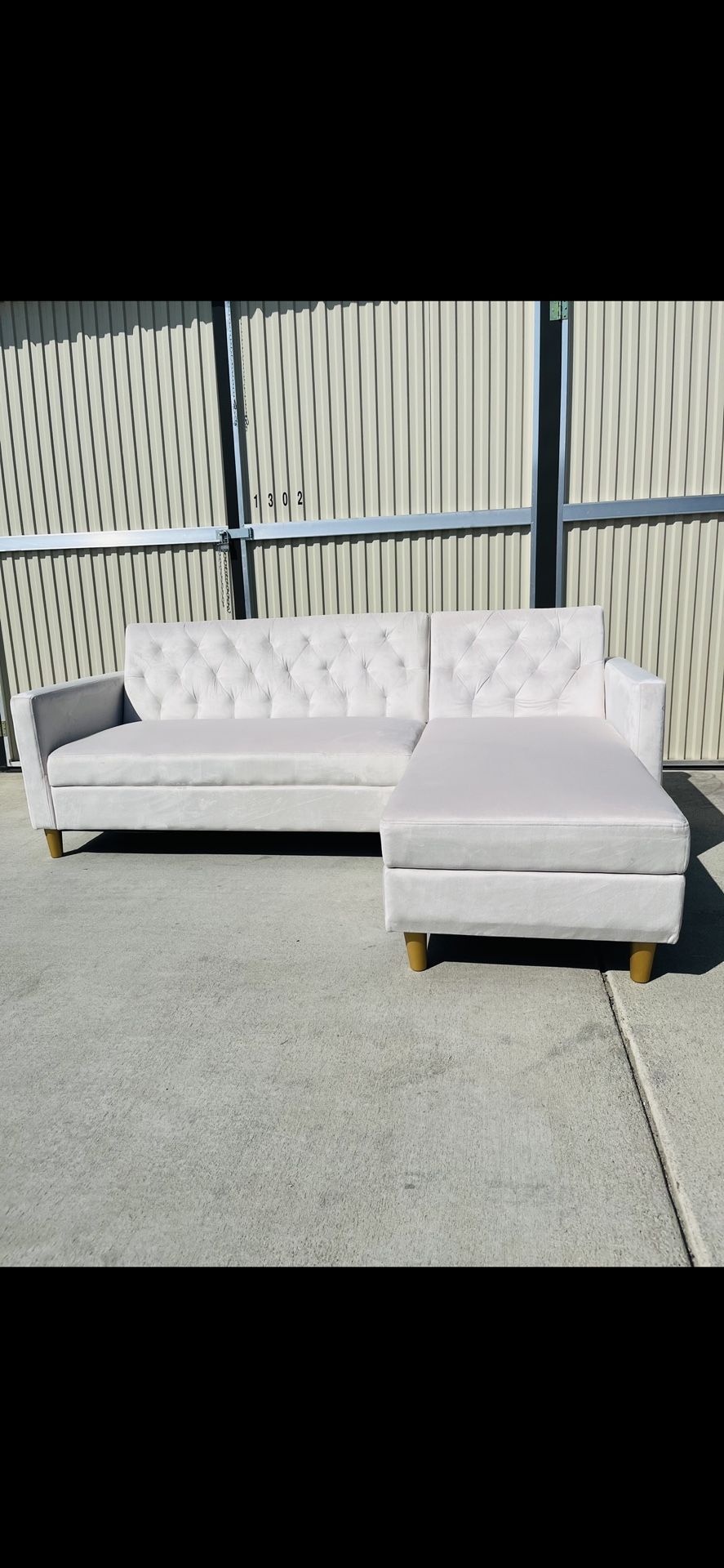 Brand New Ivory L-Shaped Reversible Sofa With Storage Chaise and Gold Legs 