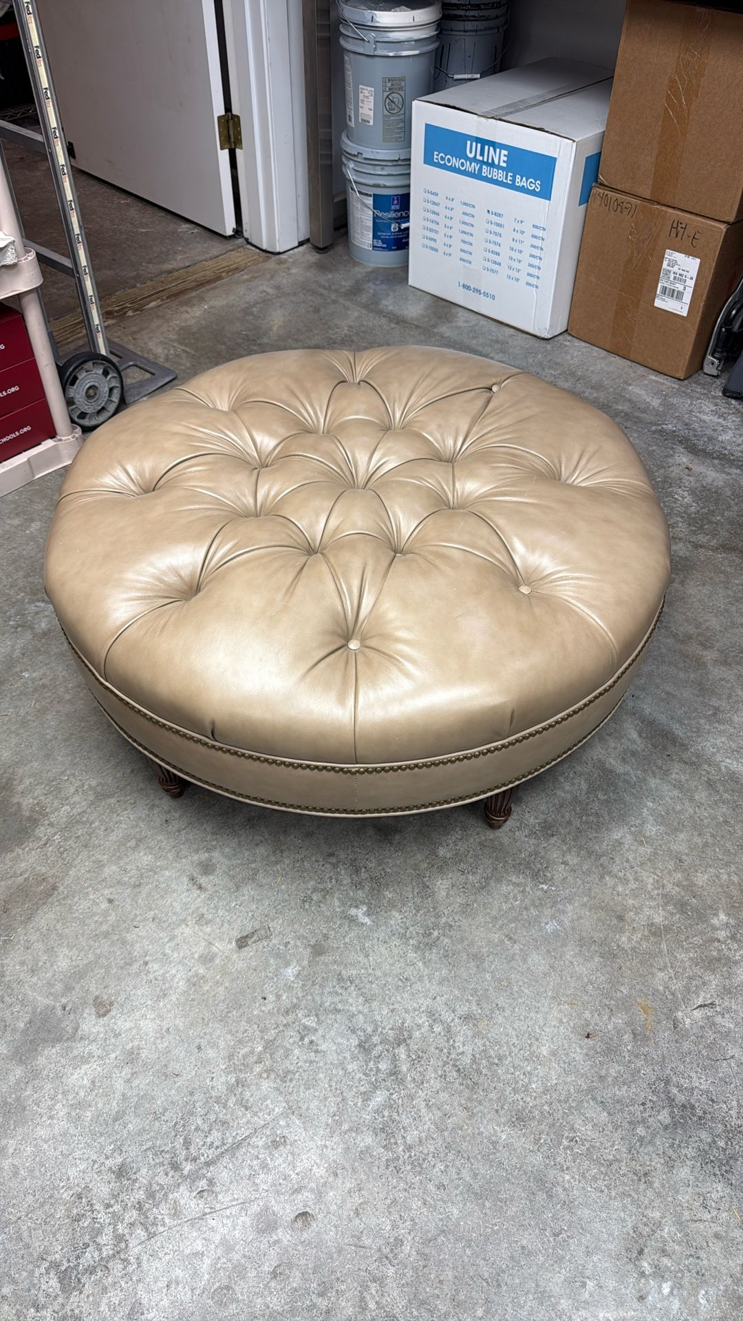 Tan Leather Ottoman / Wood Legs/ Bronze Detail