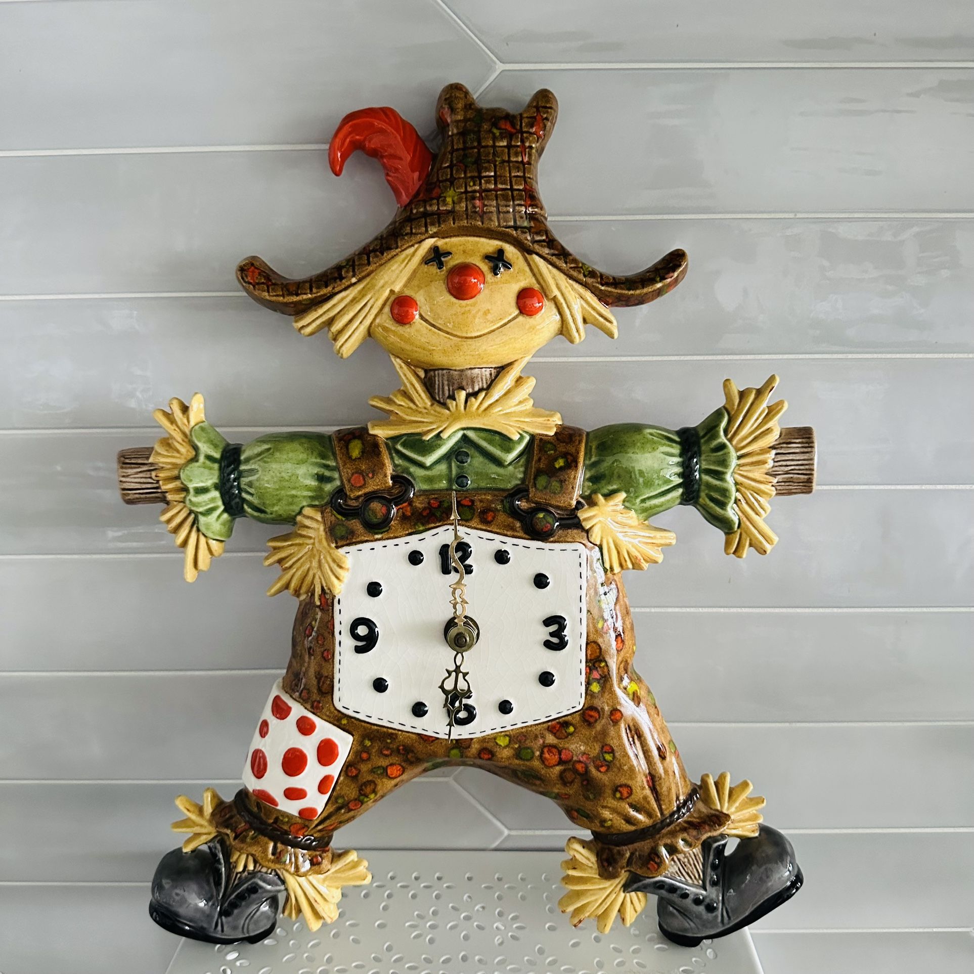 Vintage ceramic Halloween Fall scarecrow wall clock. Large  16” tall x 12 1/2” wide . Multi retro colors drip glaze. No chips or cracks. Clock works .