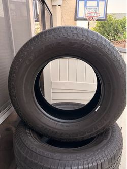 Set of 4 Bridgestone Dueler H/T tires, size 265/70R18