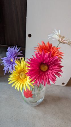 Faux flowers and hand painted vases.