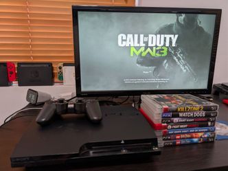Sony PlayStation 3 Slim with Controller and 9 Games