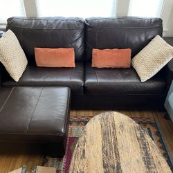 Ashley Fairplay faux leather couch w/ ottoman