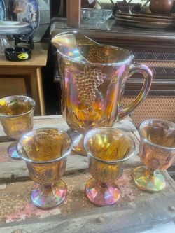 Antique carnival glass pitcher and glasses set