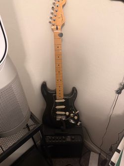 Fender Stratocaster w/amp (LT25), carry bag, and extra picks.