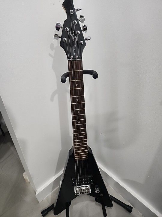 Flying V Guitar Good Condition Minor Chip Plays Great Comes With A Fender 15g Amp Power Cable Included PRICE NEGOTIABLE.