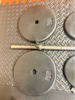 48 inches Steel Standard Barbell W/Weight Plates: 25s, 10s and 5s ponders. 93 # Brute W.
