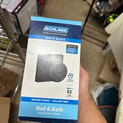 Schlage Bowery Knob with Collins Trim in a matte black finish, designed for bed and bath doors.  