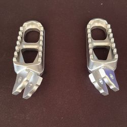 surron foot pegs